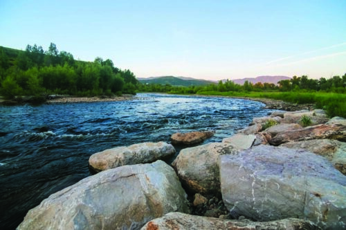 Yampa River flows past rocks in Steamboat Springs